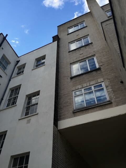 Surveying imagery used to represent party wall advice and adjoining owner risk management.